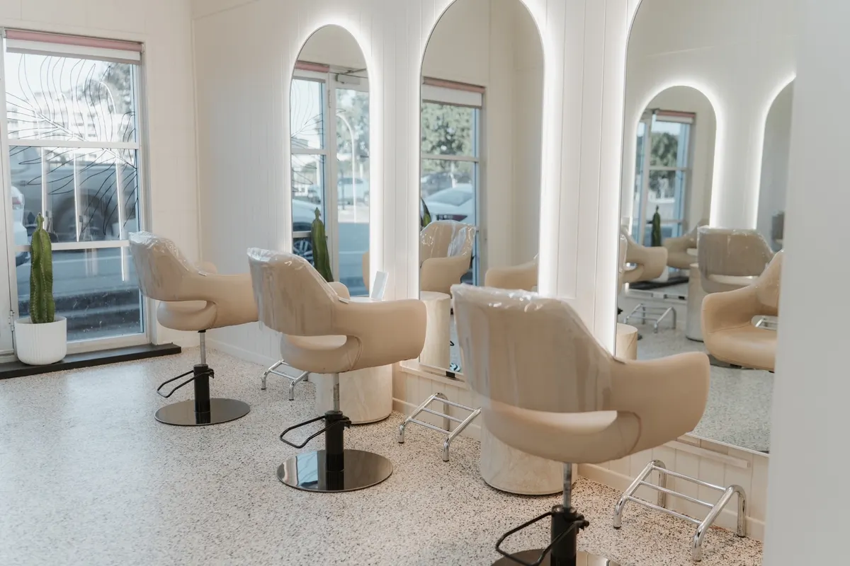 Styling chairs and arched mirrors at Marble & Mane